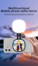 Espelho de selfie magnético com luz de preenchimento ajustável em duas cores. Suporte reversível multifuncional para celular. Ideal para fotos e vídeos profissionais com iluminação equilibrada.